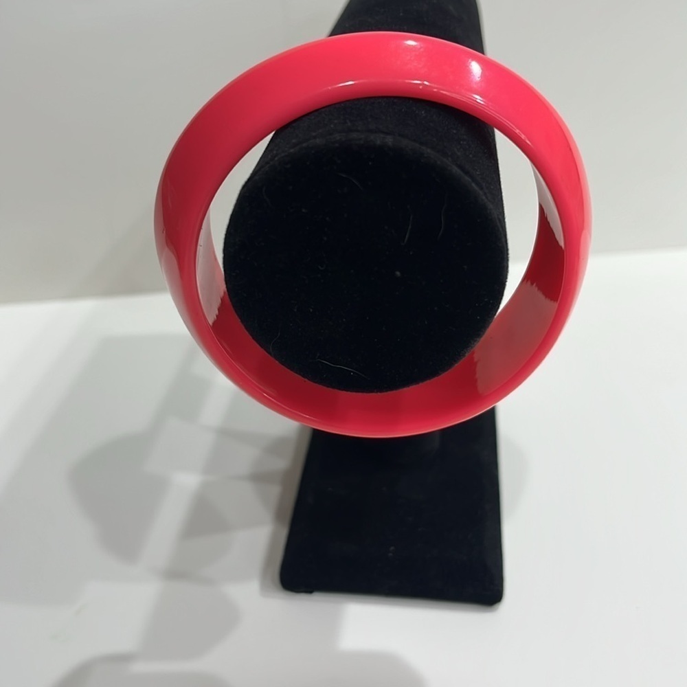 Bright pink bangle bracelet. Bold and stylish accessory. Faux, Costume Jewelry.